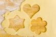 Biscuit dough with the shapes of cut-out biscuits