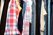 Coloured woman clothes hanged in the wardrobe.
