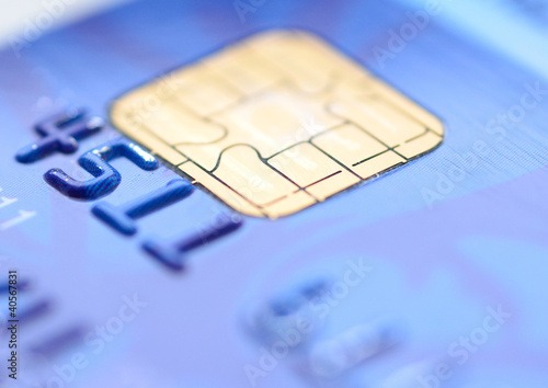 Photo: Closeup image of old blue credit card. Closeup image of old blue credit card.
