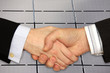 Businessmen shaking hands in front of Solar Power Station