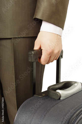 Photo: man holding luggage man holding luggage