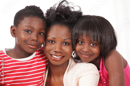 Photo: Happy family with mom and two kids Happy family with mom and two kids