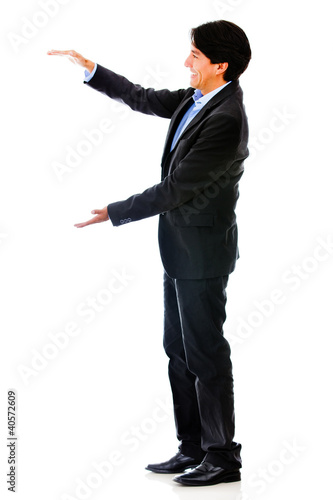 Photo: Businessman holding something Businessman holding something
