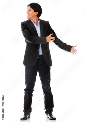 Photo: Businessman holding an object Businessman holding an object