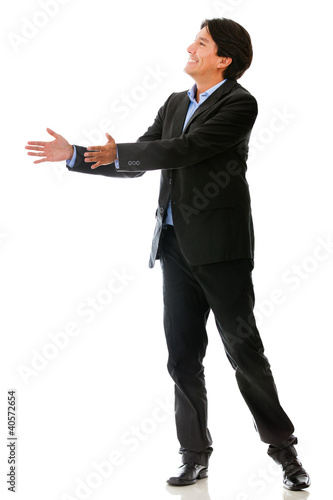 Photo: Businessman passing an object Businessman passing an object