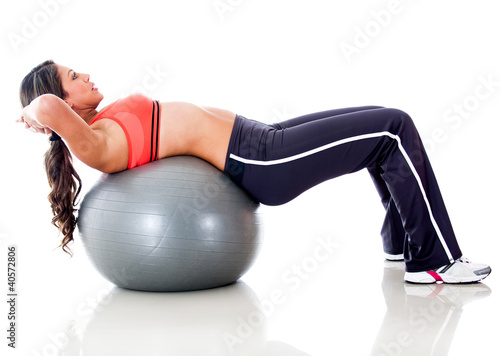 Foto: Woman exercising with ball Woman exercising with ball