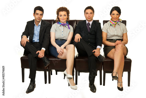 Photo: Four business people on chairs Four business people on chairs
