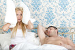 snoring man and frustrated woman