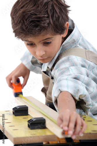 Photo: Boy doing carpentry Boy doing carpentry