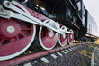 old steam locomotive wheel and rods