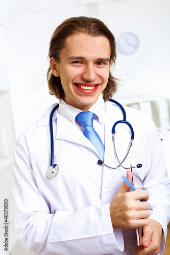 Photo: Friendly doctor in medical office Friendly doctor in medical office