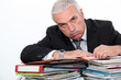 Man leaning on paperwork