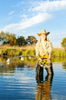 woman fishing in pond