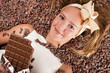 사진:beautiful girl with chocolate on cocoa beans beautiful girl with chocolate on cocoa beans