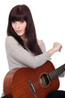 Woman playing the guitar