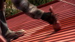 Painting roof of a private house, close-up