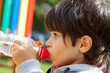 little boy drinking pure water