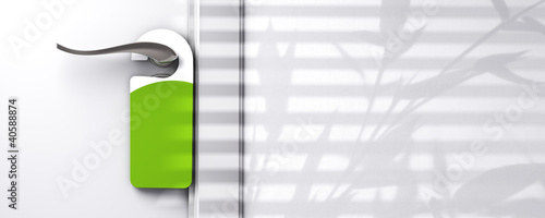 Illustration: green blank door hanger fixed onto a knob green blank door hanger fixed onto a knob