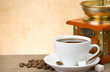 cup of coffee and coffee grinder