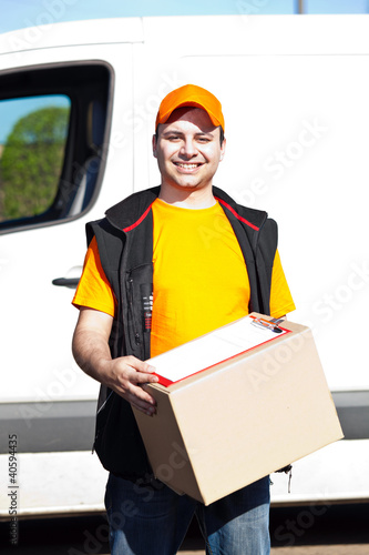 Photo: Delivery boy holding a box Delivery boy holding a box