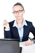 Business woman sitting with laptop in office