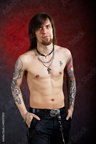 Photo: Brutal thoughtful man with tattoo Brutal thoughtful man with tattoo