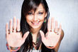 smiling girl show stop with hands