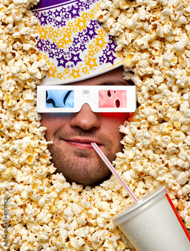 Photo: Face in popcorn watching 3D movie Face in popcorn watching 3D movie