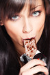woman eat chocolate bar
