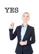 Business woman pointing up on sign yes