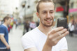 Young Man with cell phone walking Young Man with cell phone walking