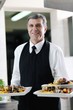 male chef presenting food
