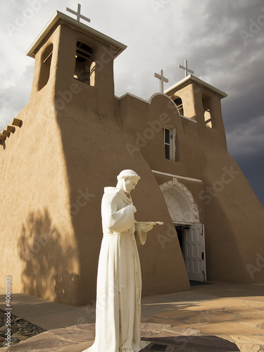 Photo: Saint Francis Statue With Church Saint Francis Statue With Church