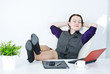 Business woman relax with legs on the table