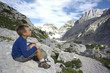 Little boy loooking at mountain view