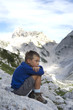Little boy admiring mountain landscape