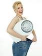 Beautiful girl with scale is proud to lose weight