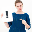 woman with board exclamation point