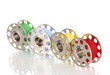 Metal spools of thread isolated on white