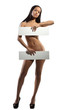 Very beautiful nude model is holding a board in her hands on whi