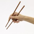 Hand with chopsticks