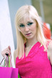 Young blonde shopping woman with bags. Young blonde shopping woman with bags.