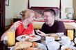 Happy couple at breakfast Happy couple at breakfast