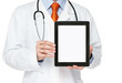 Photo: Doctor holding blank digital tablet with clipping path Doctor holding blank digital tablet with clipping path