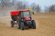 Foto: an agricultural tractor starts a chemical treatment an agricultural tractor starts a chemical treatment