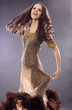 The young brunette тацует in a long dress