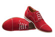 Red men laced shoes isolated over white Red men laced shoes isolated over white