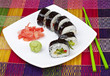 Sushi with ginger and wasabi on a white plate