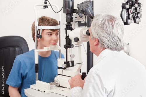 Photo: Optometrist Doing Sight Testing Optometrist Doing Sight Testing
