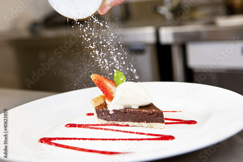 Photo: Closeup of Dark chocolate tart on a plate Closeup of Dark chocolate tart on a plate